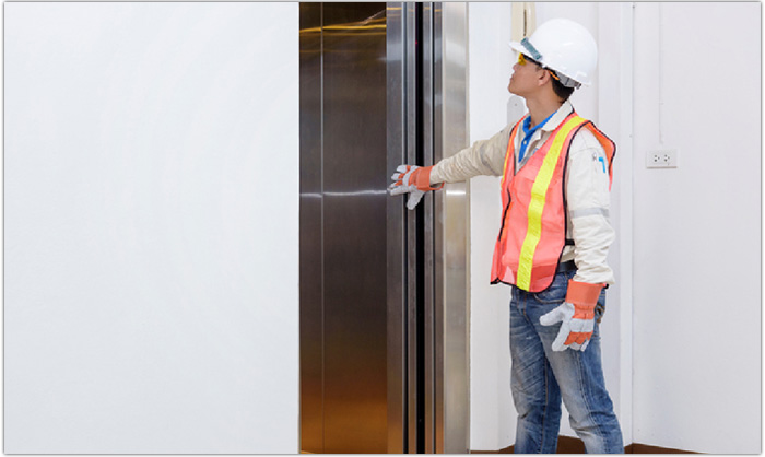 Elevator Technician Performing Maintenance
